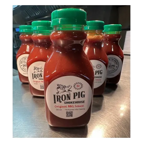 Bottles of Iron Pig Smokehouse BBQ sauce