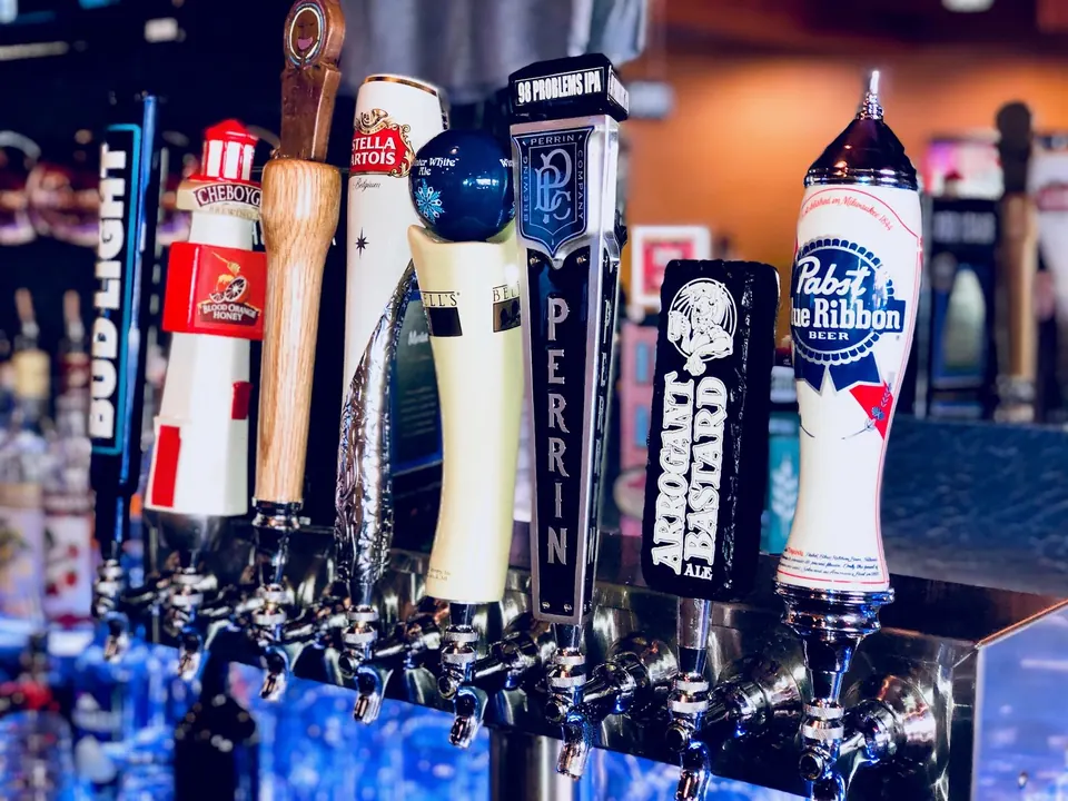 Row of draft beer taps behind the Iron Pig bar