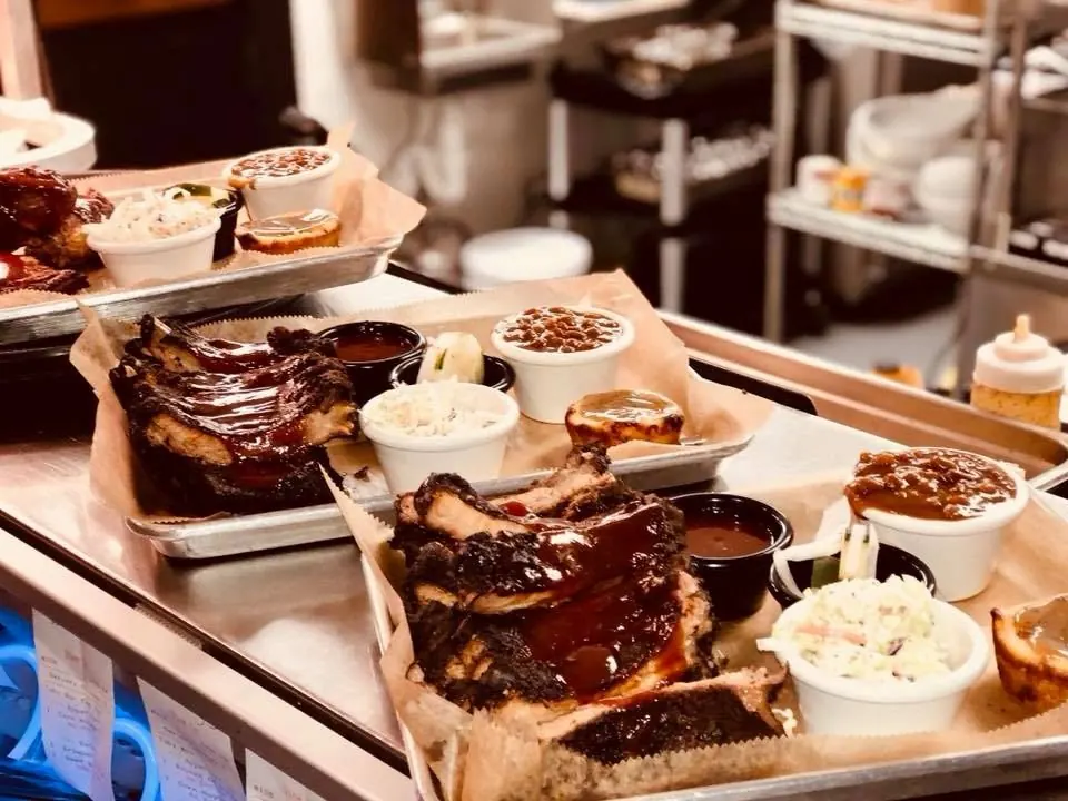Trays of smoked ribs and sides